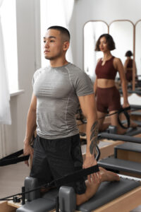 people taking pilates reformer class (1)